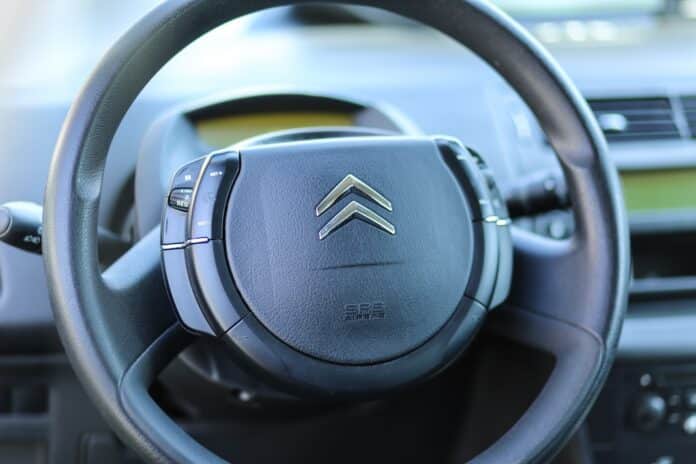 Citroen C4 modern steering wheel close up with brand logo airbag