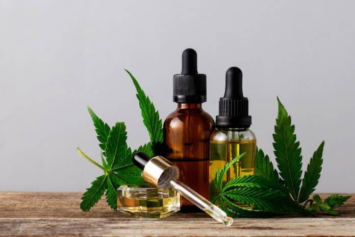 Cannabis oil in bottles on gray background with copy space. CBD CANNABIS