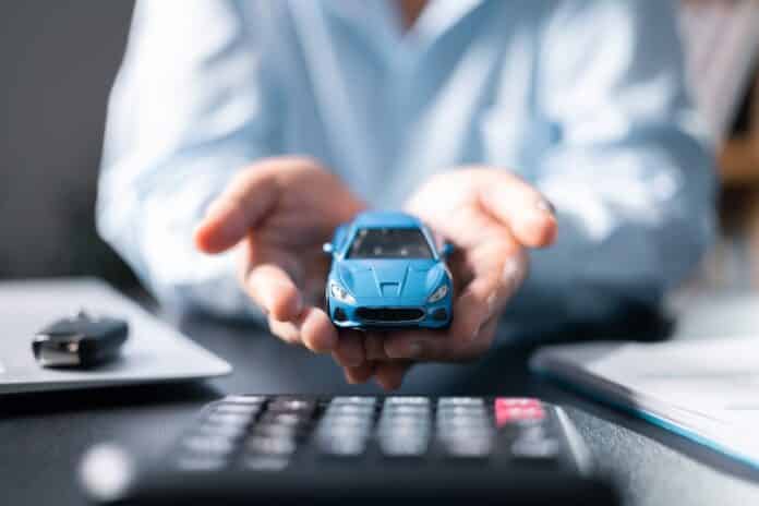 Car finance and insurance concept. Young woman selling or buying car online. Blur with office background, Protecting and after-sales care concept. offering financial and insurance service. Rc-auto