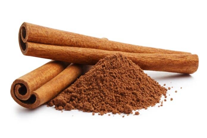 Cinnamon sticks and powder, isolated on white background CANNELLA