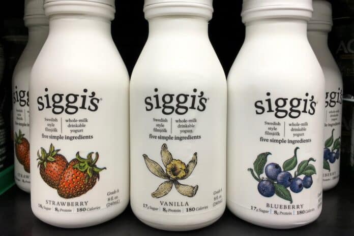 Alameda, CA - October 24, 2017: Store shelf with bottles of siggi's brand drinkable yogurt. An Icelandic version of yogurt launched in Whole Foods Market stores across the United States in 2008. AROMI