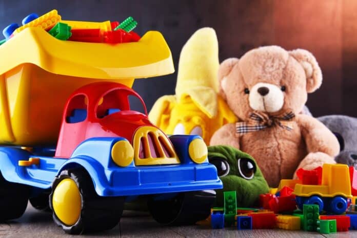 Colorful plastic and plush toys in a children's room giocattoli