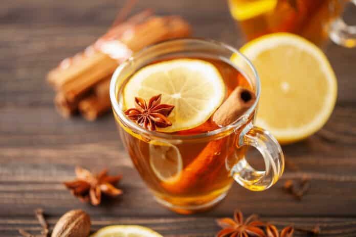 Spiced drink cocktail for New Year, Christmas, winter or autumn holidays. Hot Toddy. IRRADIAZIONE