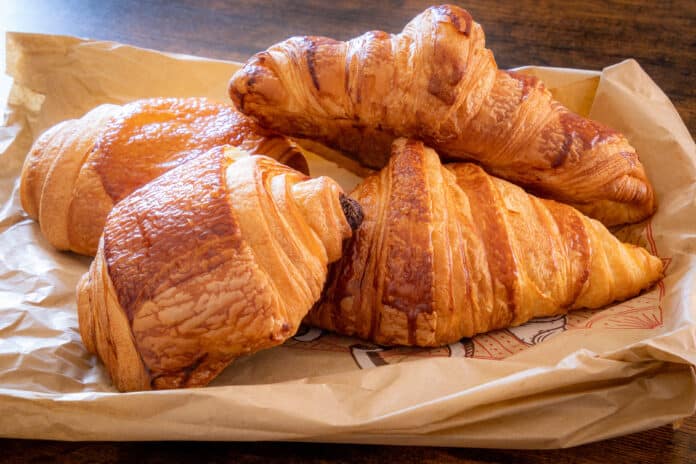 croissant and chocolate bread on a table SUCRALOSIO