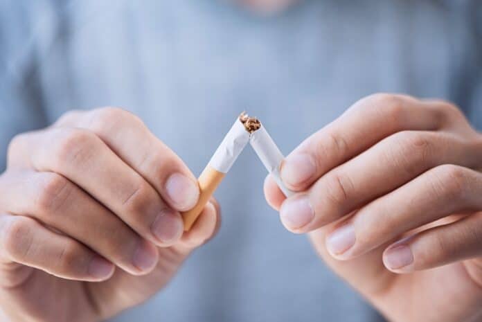 Stop cigarette, man hands breaking the cigarette for good health. fumare