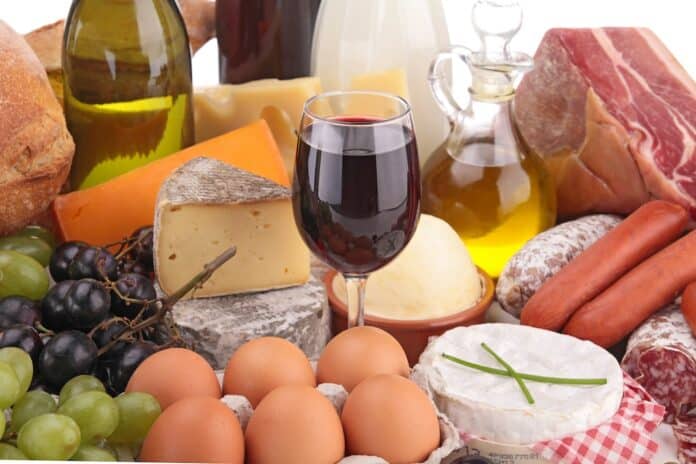 composition with wine,cheese,bread,meat