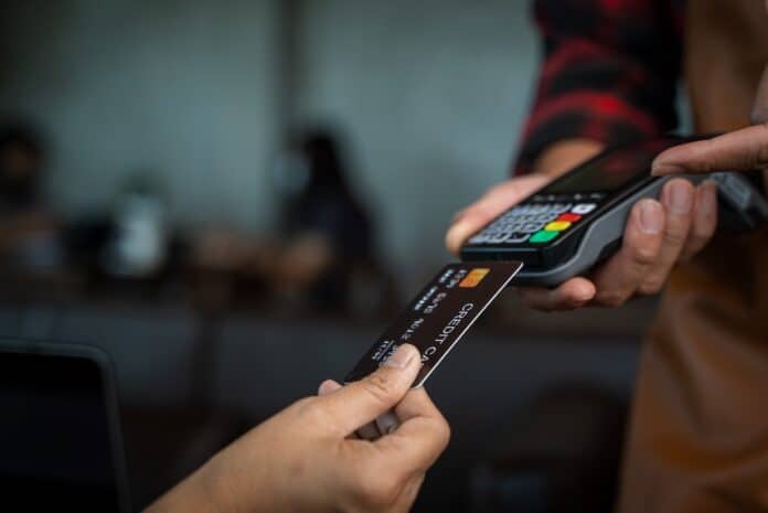 Customer paying through payment terminal in hands of waitress,Credit card payment,Buy and sell products & service. bancomat