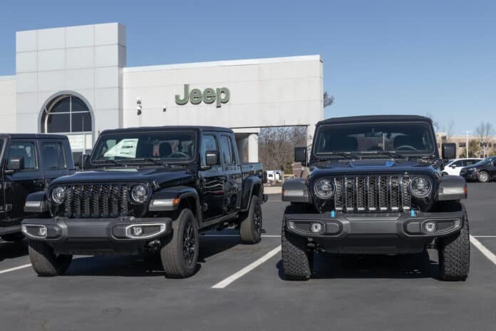 Cincinnati - Circa February 2023: Jeep Gladiator and Wrangler display at a dealership. Jeep is a well known off-road brand.