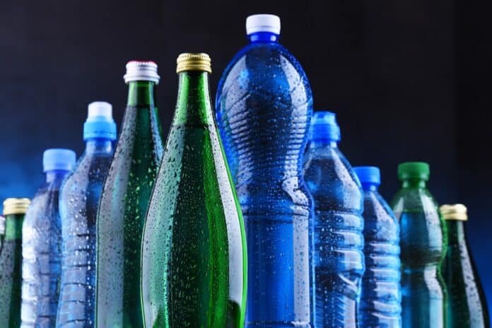 Different sorts of bottles containing mineral water acqua, pfas