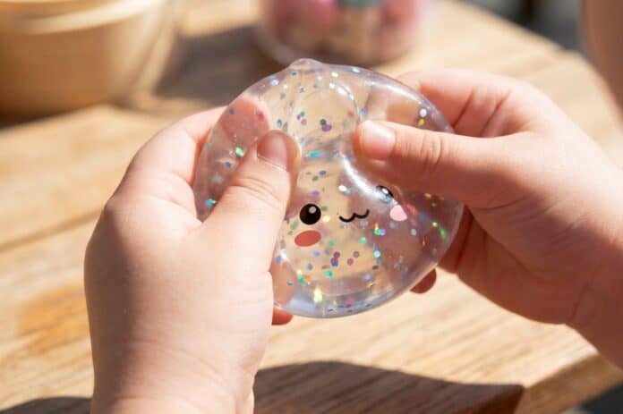 Children hands playing with squishy dumpling fidget toy Squishy
