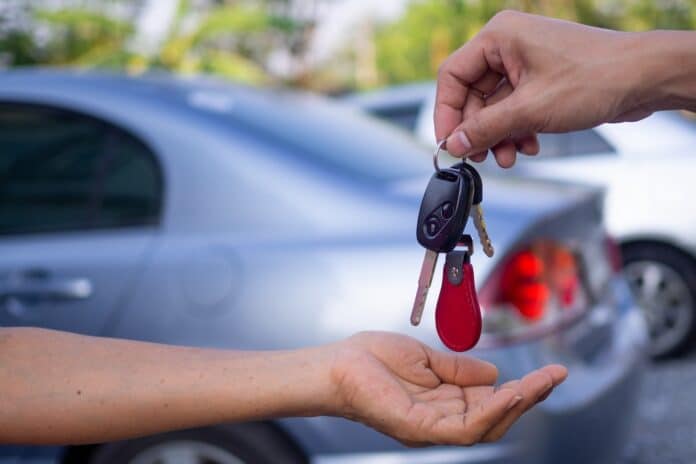 Sales agencies are selling cars and giving keys to new owners. sell car or rental car autonoleggio, macchina, auto